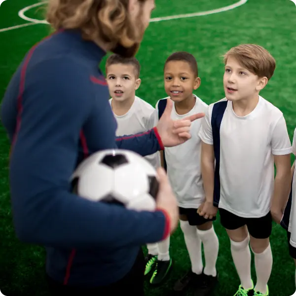 Coach talking with young players